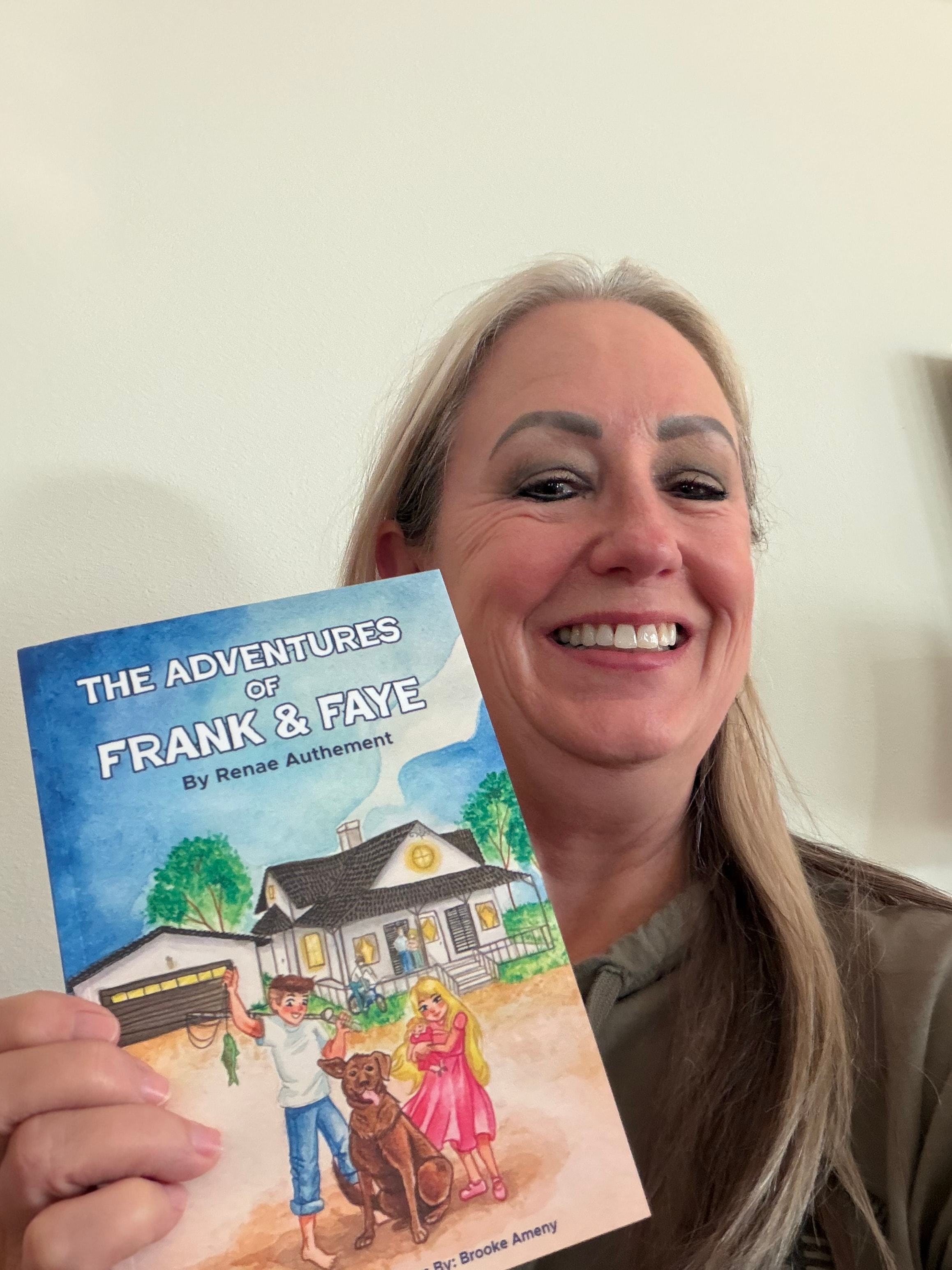 Renae Authement holding The Adventures of Frank & Faye